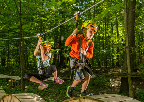 Two kids on the Kids Adventure Course at Lake Erie Canopy Tours
