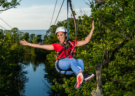 Girl in a red shirt on a zipline